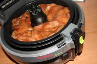 Place the marinated chicken pieces in the upper...