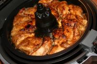 Turn on the Actifry and set the CHICKEN program by...
