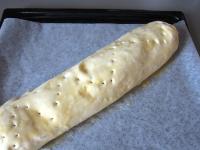 Place strudel on the tray covered with baking...