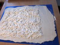 Roll out puff pastry and sprinkle with grated...