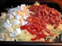 Coarsely grate potatoes and put them in a deep...