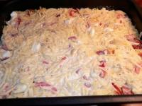 Evenly spread mixture into deep baking tin....