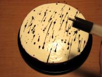 Melt chocolate and gently decorate surface of the...