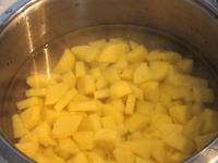 Peel potatoes, cut into the cubes and let it cook...