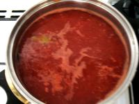 Pour hot water over the tomatoes, in a while take...