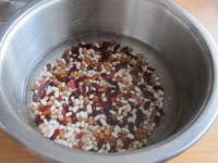 In a saucepan pour the water over sorted beans and...