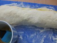 Twist the dough steady. Brush one edge with beaten...