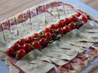 Lay tomatoes cut into halves on the olives and...
