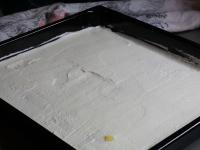Spread whipped cream over the layer of...