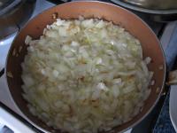 Clean the onion, cut it finely and fry it until...