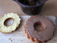 Spread half of the cream over the middle layer. ...