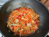 Add vegetables to the meat and stir....