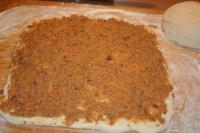 On the floured plate we spread the dough, which we...
