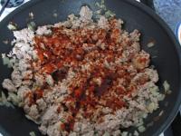 Remove meat from heat, add ground red pepper, stir...