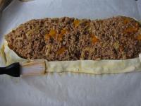Place remaining meat filling on the eggs and shape...