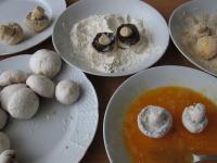 Trim the mushrooms. Wrap them in fine flour,...