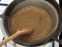 Remove the sauce from the cooker and strain it....