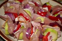 Break the skewers in half, alternately skewe the...