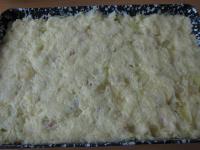 Equally spread second half of the potato dough on...