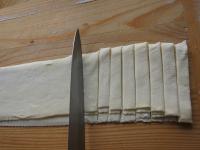 Lay individual floured strips on top of each other...