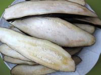 Season the slices of eggplant with salt from both...