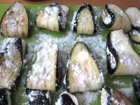 Sprinkle the stuffed eggplants on both sides with...