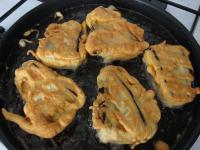 Turn the eggplants and fry them for 5 minutes on...