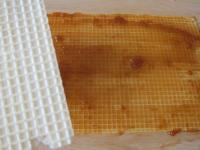 Spread the jam over two cake wafers (cca 15x35 cm)...
