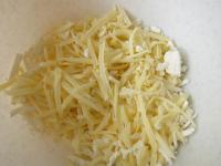 Roughly grate both kinds of cheese....