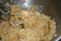 Let the dough cool slightly. Gradually beat eggs,...