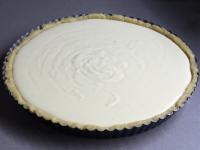 Gradually press the dough into the cake form. Pour...