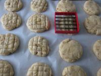 Place the balls into the baking tin lined with...