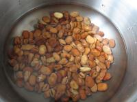 Sort dried broad beans and put them in cold water...