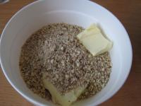 Finely chop almonds or grind them. Put them into a...