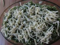 Grease baking dish with oil, evenly spread pasta...