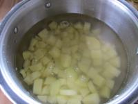 Cut peeled, washed potatoes into the small cubes...