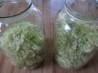 Place the flowers in two larger bottles, 20 in...