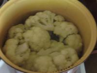 Take the cauliflower into pieces, wash and boil it...