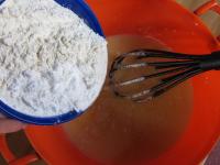 Add flour with baking powder. Mix to a smooth...