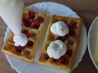 Decorate the poured waffles with whipped cream and...