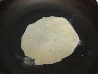 Heat an older dry non-stick pan and lay loksha on...
