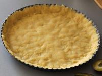 Grease the cake pan with the butter and evenly...