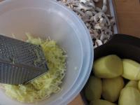 Peel the potatoes and grate them like the onion....