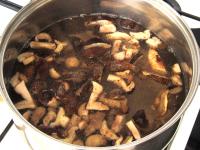 Put mushrooms in a pot, add water, ground caraway,...