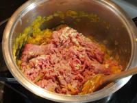 Add minced meat to the vegetable basis....