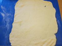 Use a rolling pin to spread the second half of the...