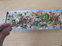 Pour the dough into a mold, add candied fruit,...