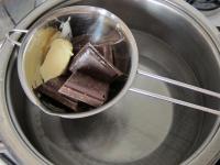 Melt the chocolate in a water bath with a piece of...