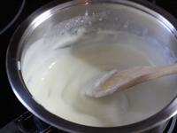 Gradually add hot milk and cook until the white...