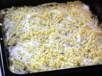 Coarsely grate dough from fridge on top of the egg...